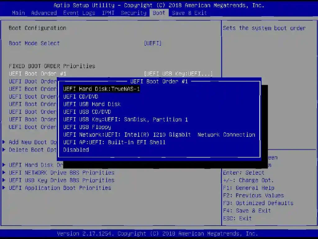 BIOS interface showing the UEFI boot order with 'UEFI Hard Disk: TrueNAS-1' highlighted as the first boot option.