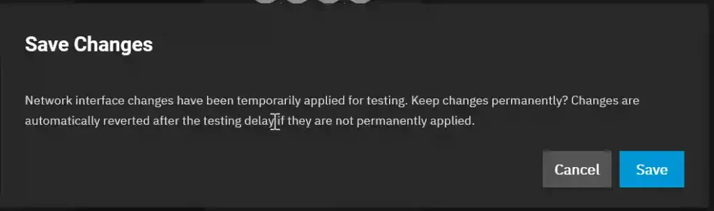 Dialog box in TrueNAS SCALE indicating that network interface changes have been temporarily applied for testing, with options to cancel or save the changes.