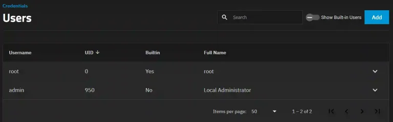 Screen displaying a 'Users' section under 'Credentials' with two user accounts listed: a built-in root account and an admin account identified as a 'Local Administrator.'