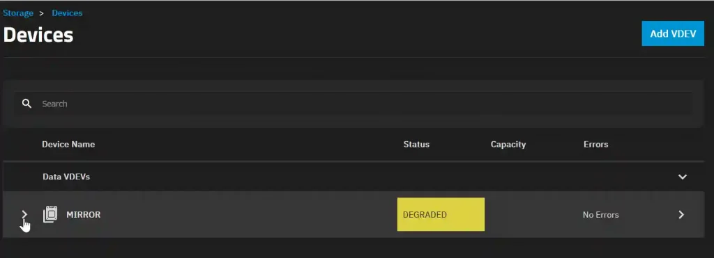 A screenshot of a computer storage management interface titled 'Devices', showing a list with a single item. The item is labeled 'MIRROR' under 'Device Name', has an icon indicating it can be interacted with by clicking, and is flagged with a 'DEGRADED' status in yellow. The interface also includes a 'Capacity' and 'Errors' column, the latter indicating 'No Errors'. On the top right, there's a button labeled 'Add VDEV'.